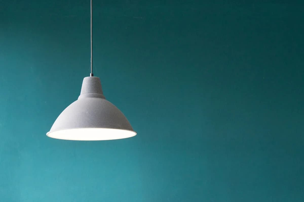 Wide-shade pendant lamp in matte metal